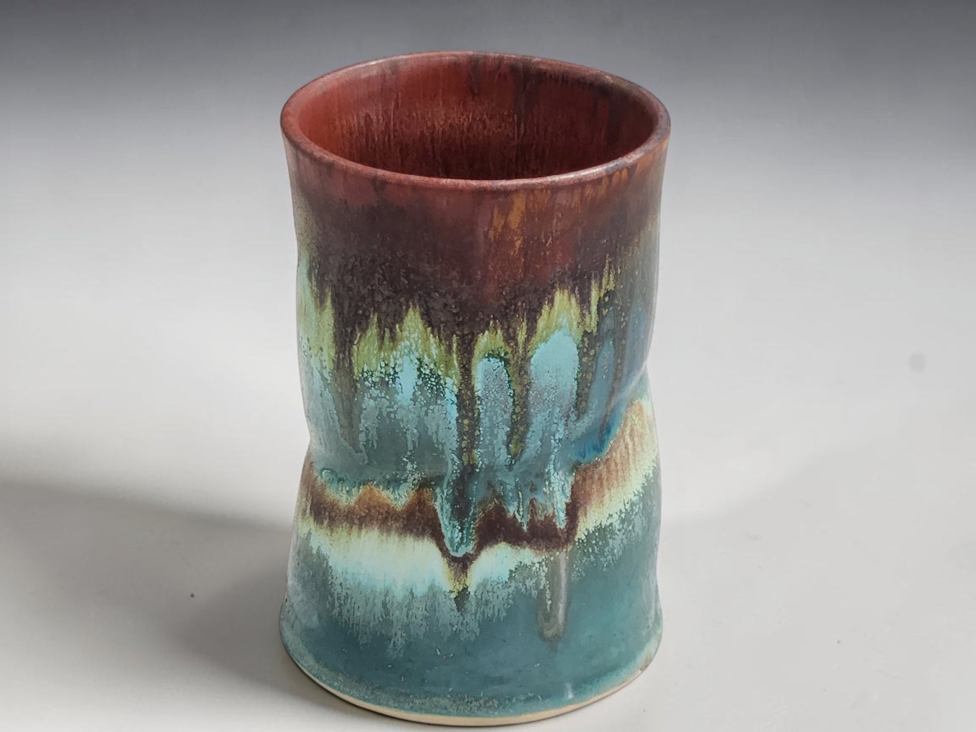 Artisan pottery mug from the Bush Creek Earth Collection with one-of-a-kind glaze patterns.