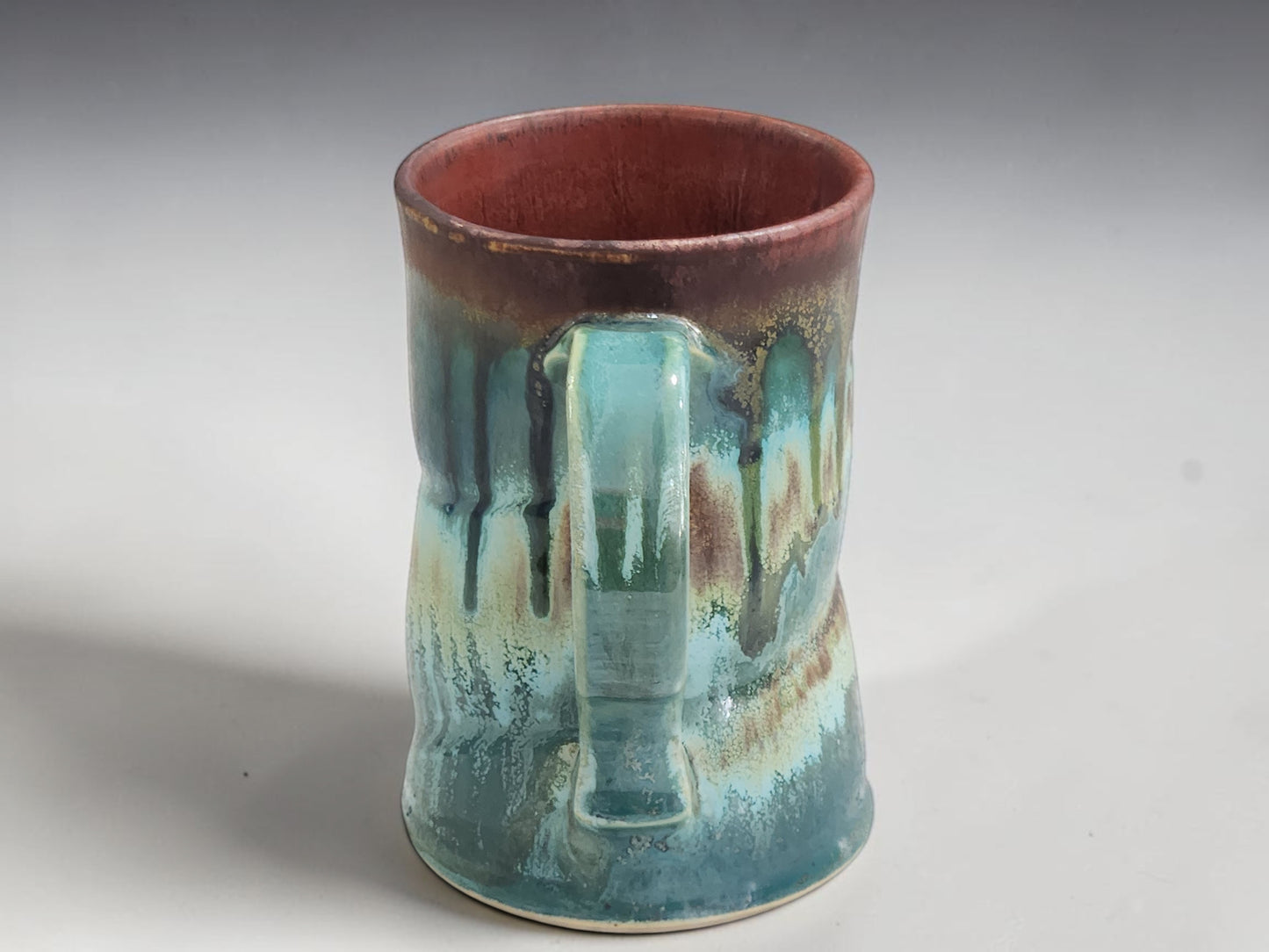 Australian handmade pottery mug with organic landscape-inspired glazes and comfortable handle.