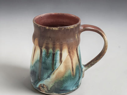 Side view of large handmade stoneware mug showing comfortable hand-pulled handle