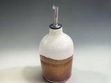 Artisan ceramic olive oil dispenser handmade in Melbourne, featuring a functional pourer and contemporary Australian pottery design.