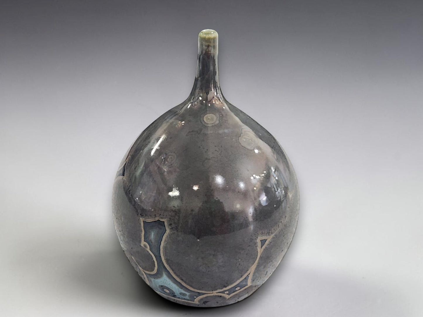 Rounded ceramic bud vase with oversized crystalline patterns