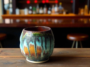 Handmade yunomi tea cup in rustic turquoise and brown glaze
