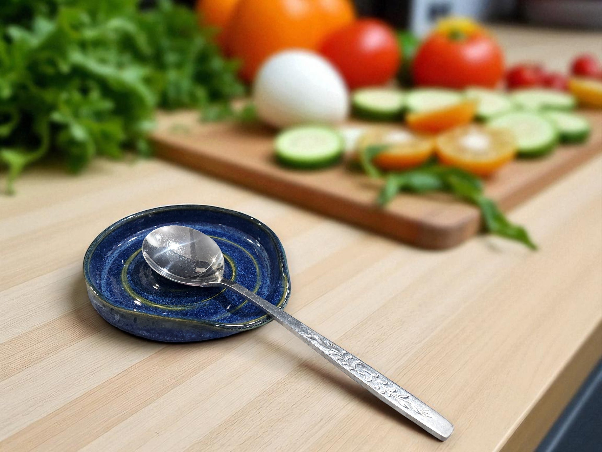 Handmade pottery spoon rest in blue glaze