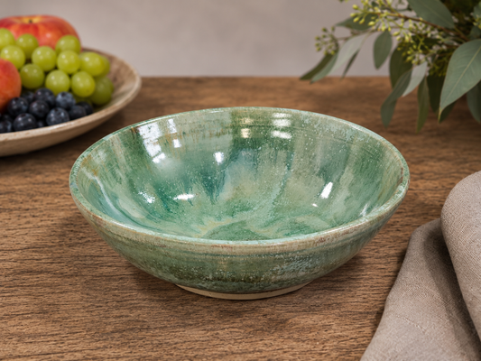 Hero image of  handmade ceramic serving bowl styled with fresh fruit