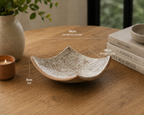 Hero image of handcrafted terracotta bowl-plate displayed on timber table with modern home décor accents
