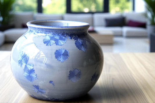 Handmade small crystalline pot in blue-grey glaze with blue crystals