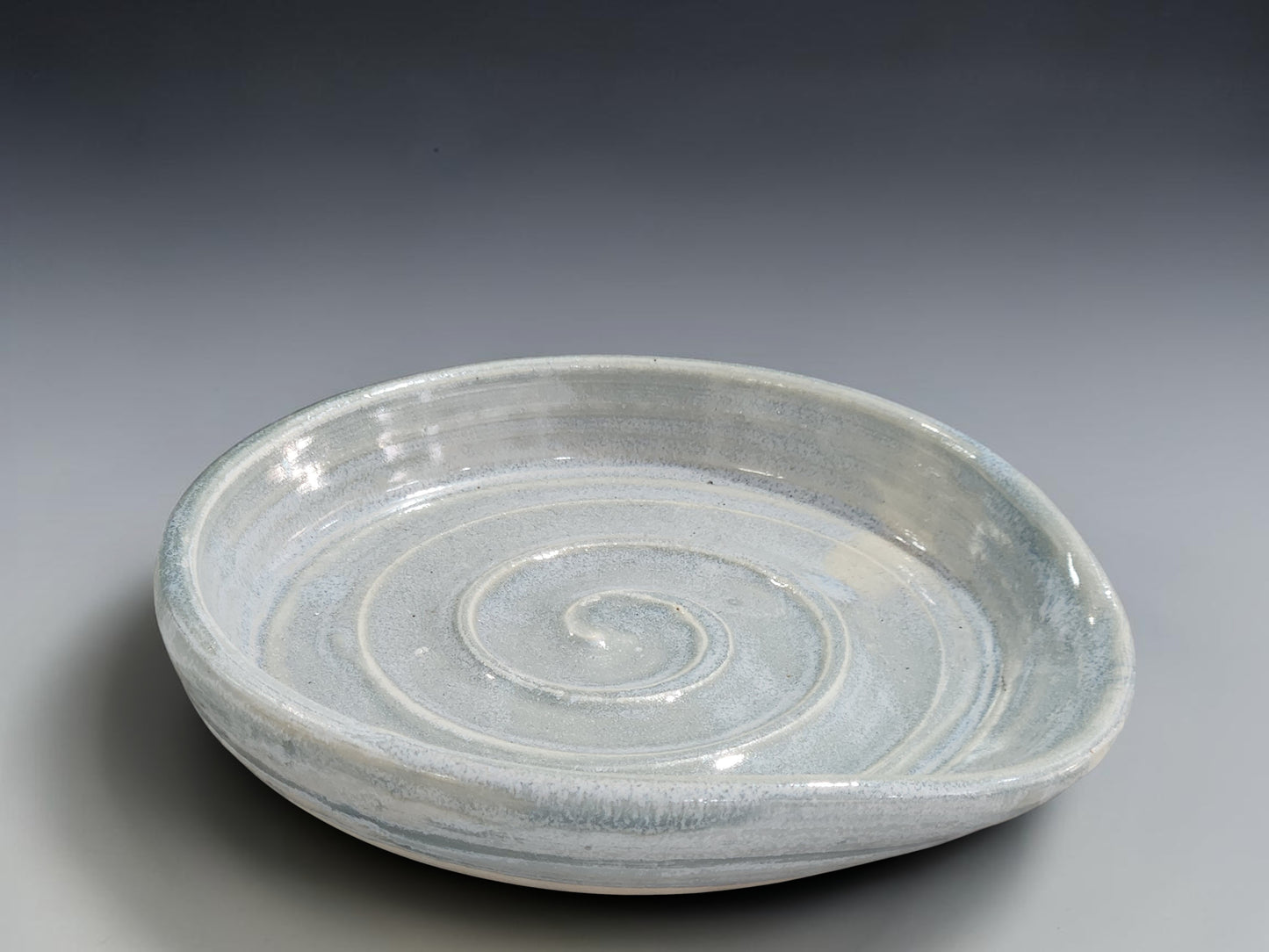 Handmade stoneware spoon rest with spiral design made by Buxton Pottery in Melbourne Australia