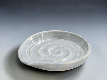 Australian handmade pottery spoon rest with raised rim and spiral detail for everyday cooking