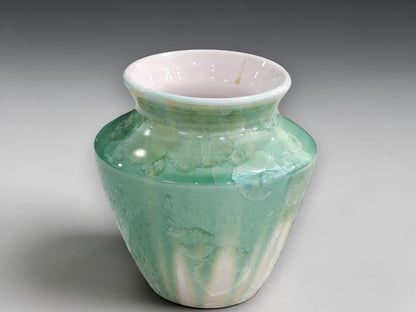 Front view of handmade soft green crystalline bud vase
