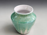 Handmade pottery vase with mint green crystalline patterns