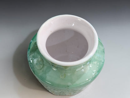 Decorative handmade ceramic vase with glossy crystalline glaze