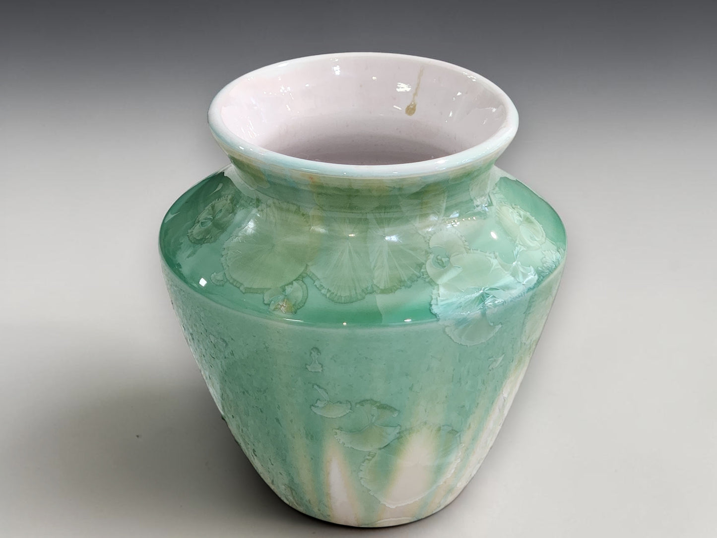 Artisan bud vase with delicate flower-like crystal formations