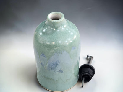 Ceramic olive oil dispenser with metal pouring spout