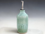 Stoneware olive oil dispenser with pouring spout in soft spearmint glaze by Buxton Pottery
