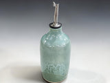 Handmade ceramic oil bottle for olive oil or vinegar in seafoam green glaze