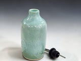 Ceramic olive oil pourer with food-safe glaze for kitchen bench or dining table