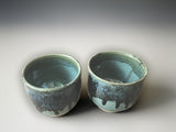 Twp ceramic handmade yunomi tea cups  with a glossy green interior