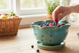 Green berry bowl with a saucer to catch water drips, in a green and blue mottled glaze made in Melbourne Australia.