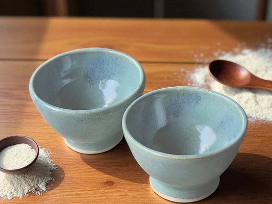 Handmade ceramic condiment bowl in green and mottled blue glaze