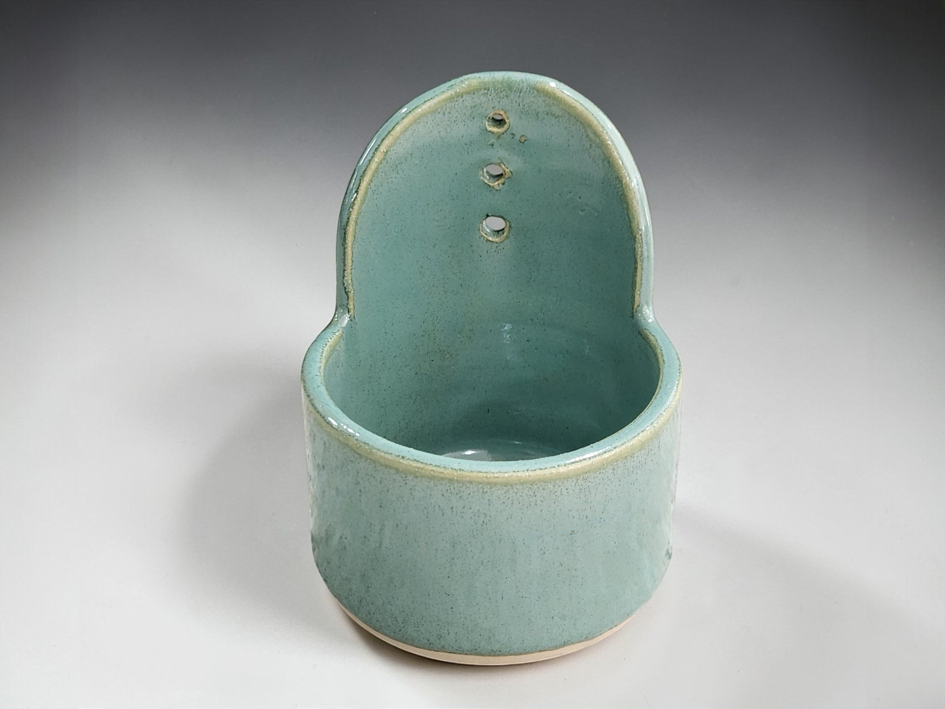 Handmade ceramic herb stripper in spearmint green pottery finish