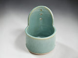 Handmade ceramic herb stripper in spearmint green pottery finish