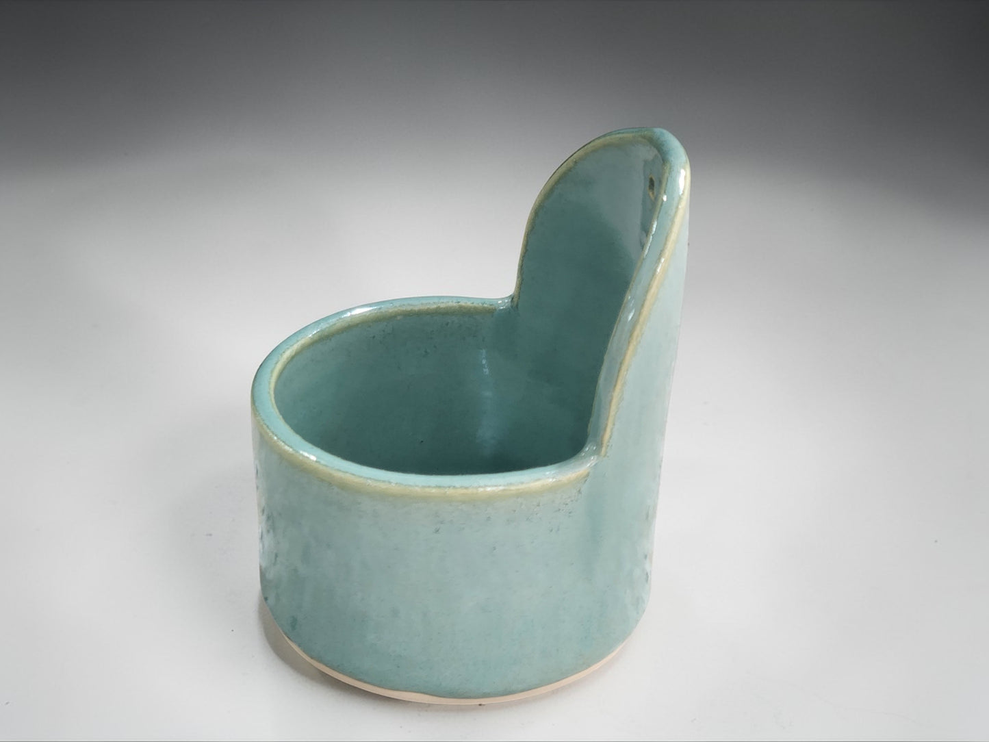 Spearmint green handmade pottery herb stripper with glossy glaze