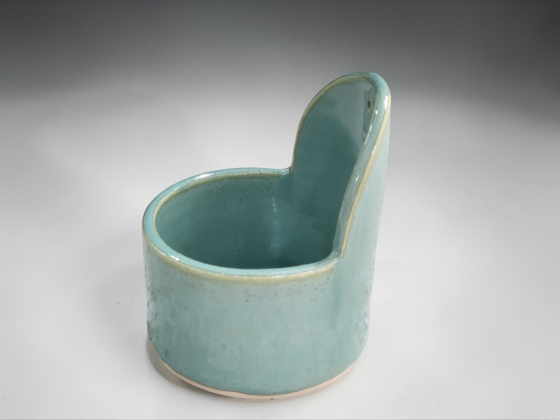 Spearmint green handmade pottery herb stripper with glossy glaze