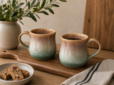 Handmade ceramic mug by Buxton Pottery featuring layered mottled brown and green glazes, handcrafted in Melbourne from stoneware clay.