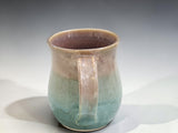 Single handmade pottery mug with curved handle and green glaze, Australian stoneware mug