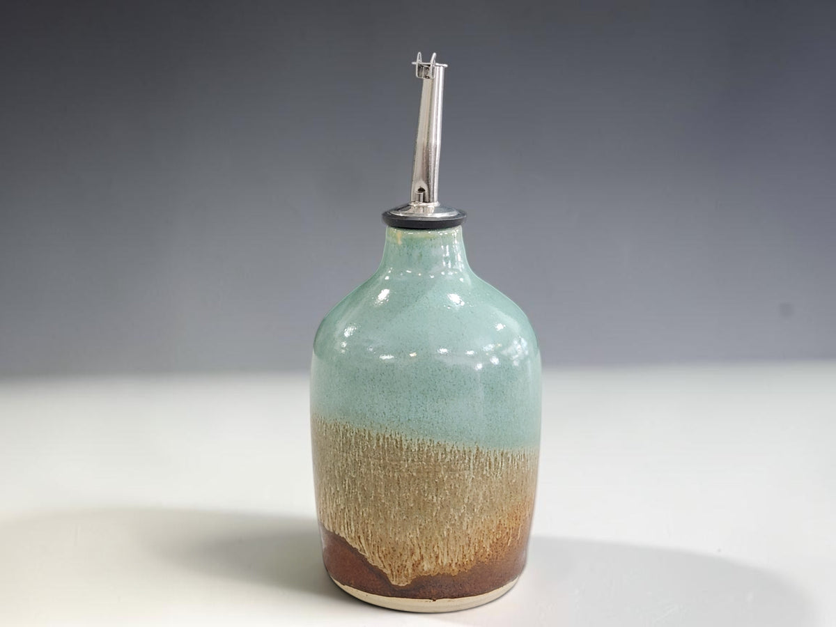 handmade oil bottle made in Melbourne with a green and red brown glaze