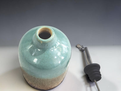 Top view of a pottery oil bottle without the spout in it.