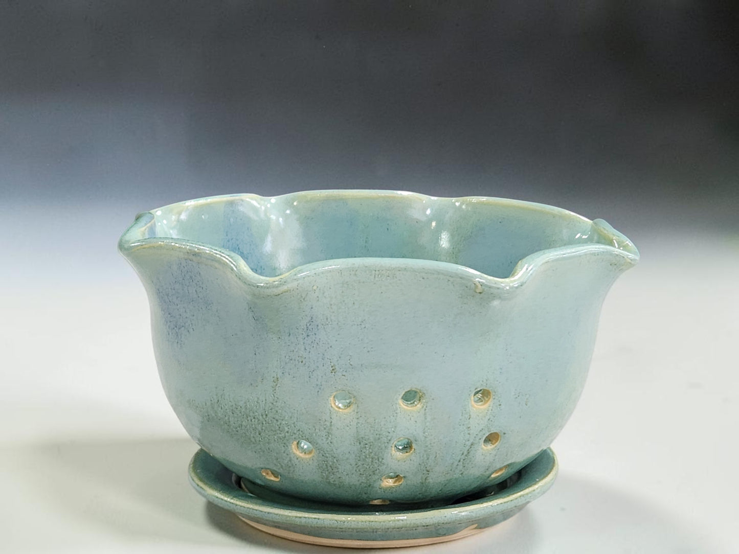Spearmint green ceramic berry bowl with matching saucer