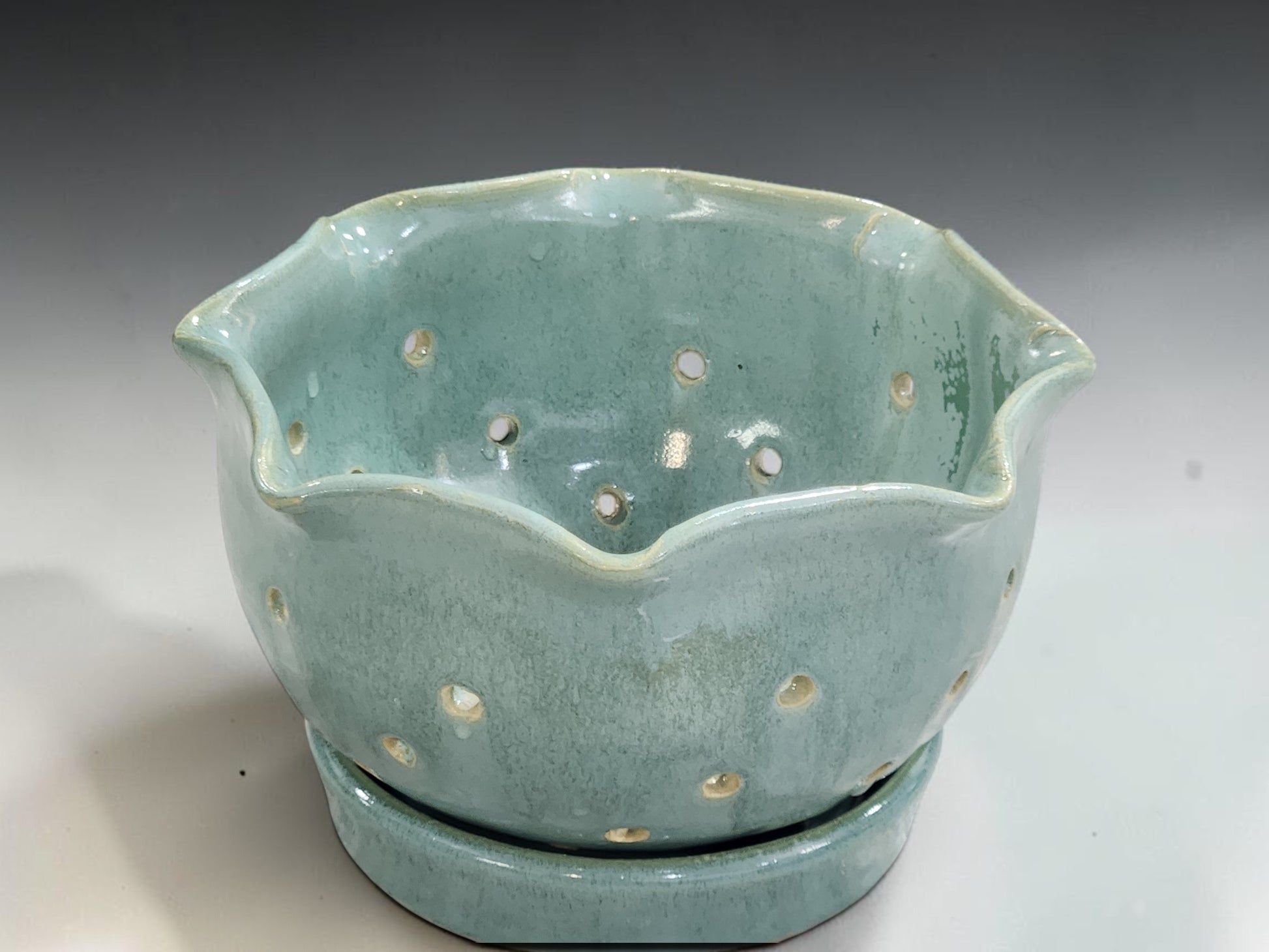 Small ceramic berry bowl for rinsing fruit in soft spearmint green stoneware glaze