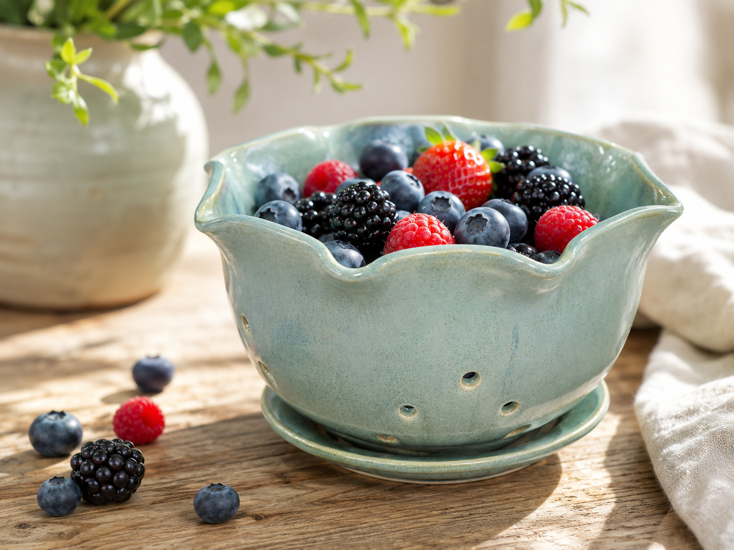 Handmade berry bowl filled with blueberries raspberries and blackberries