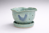 Handmade pottery berry bowl with scalloped rim and matching drip tray