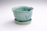 Handmade ceramic fruit rinsing bowl with perforations and saucer