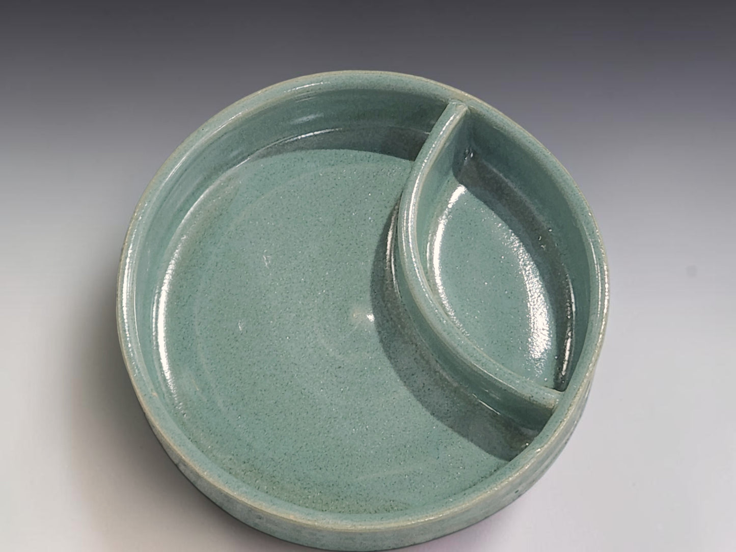 Australian handmade pottery chip and dip bowl in soft green glaze for kitchen and table use
