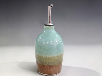 Handmade stoneware oil bottle with stainless steel pourer, crafted by Buxton Pottery in Melbourne Australia