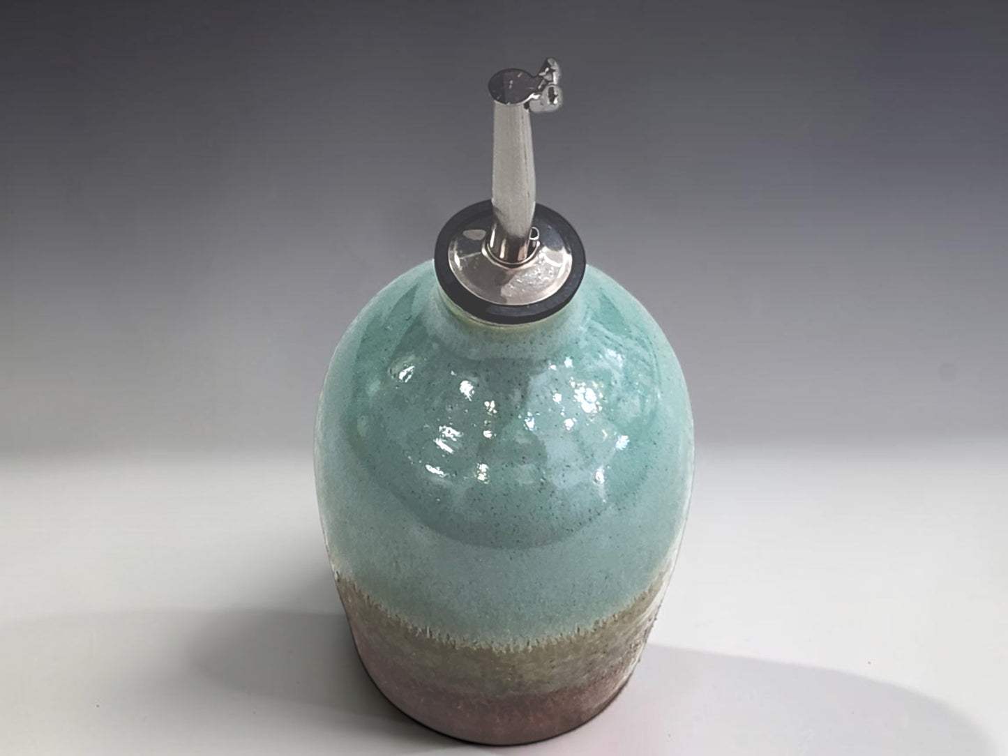 Australian handmade ceramic oil bottle with reusable stainless steel pourer and food-safe glaze