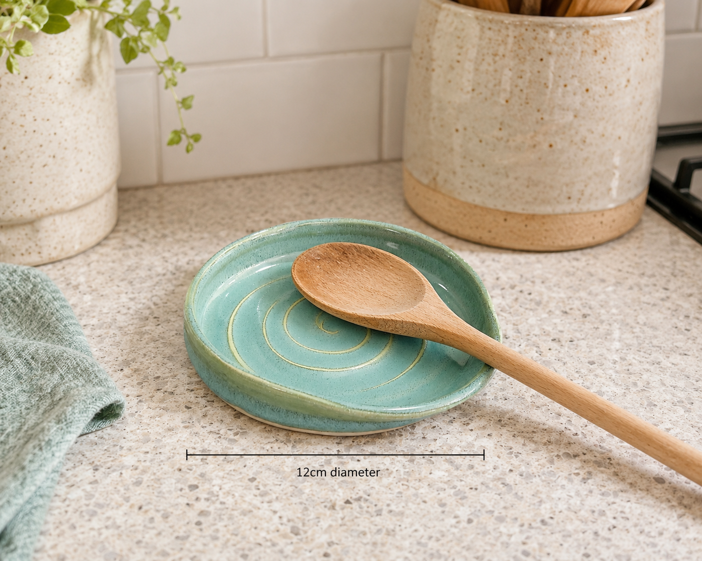 Handmade ceramic spoon rest in spearmint green glaze by Buxton Pottery, wheel-thrown stoneware made in Melbourne.