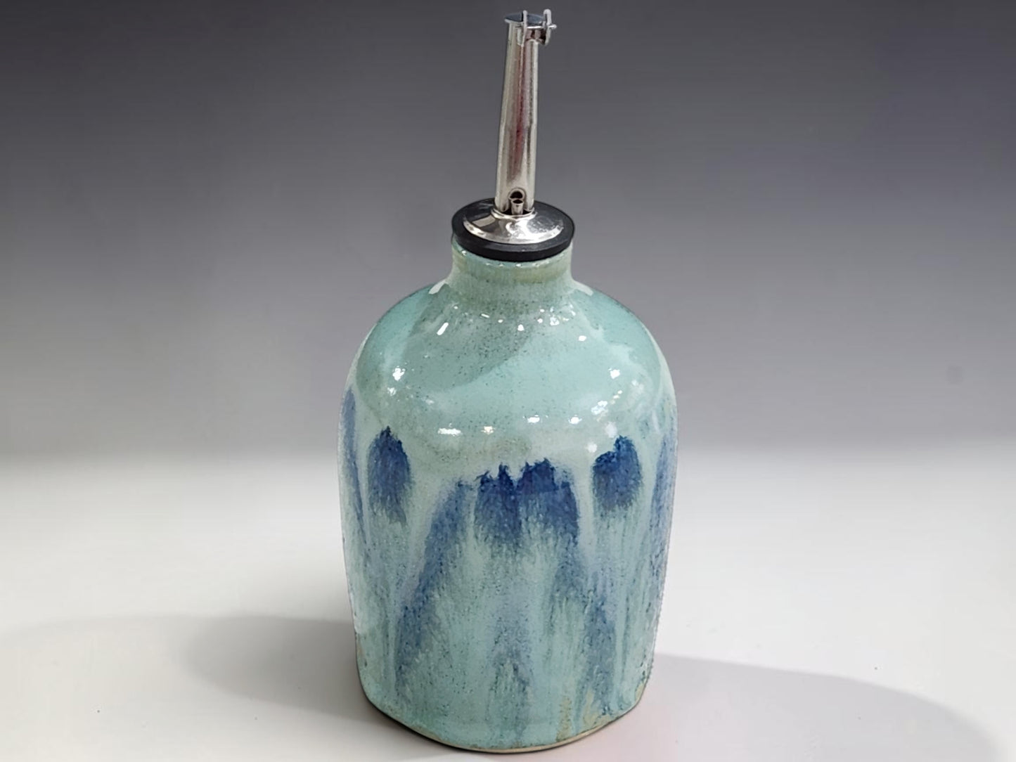 Australian handmade ceramic oil bottle with reusable stainless steel pourer for kitchen use