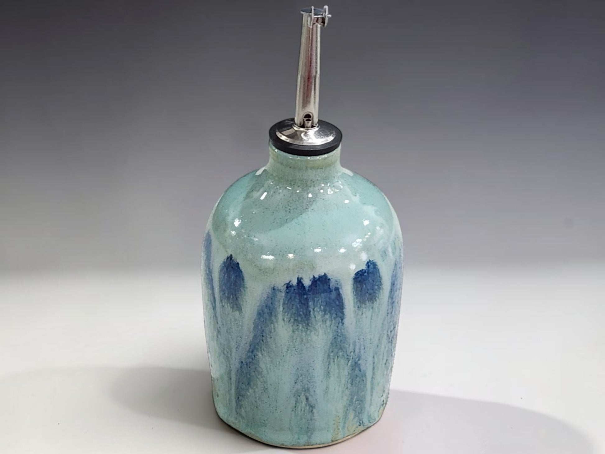 Australian handmade ceramic oil bottle with reusable stainless steel pourer for kitchen use
