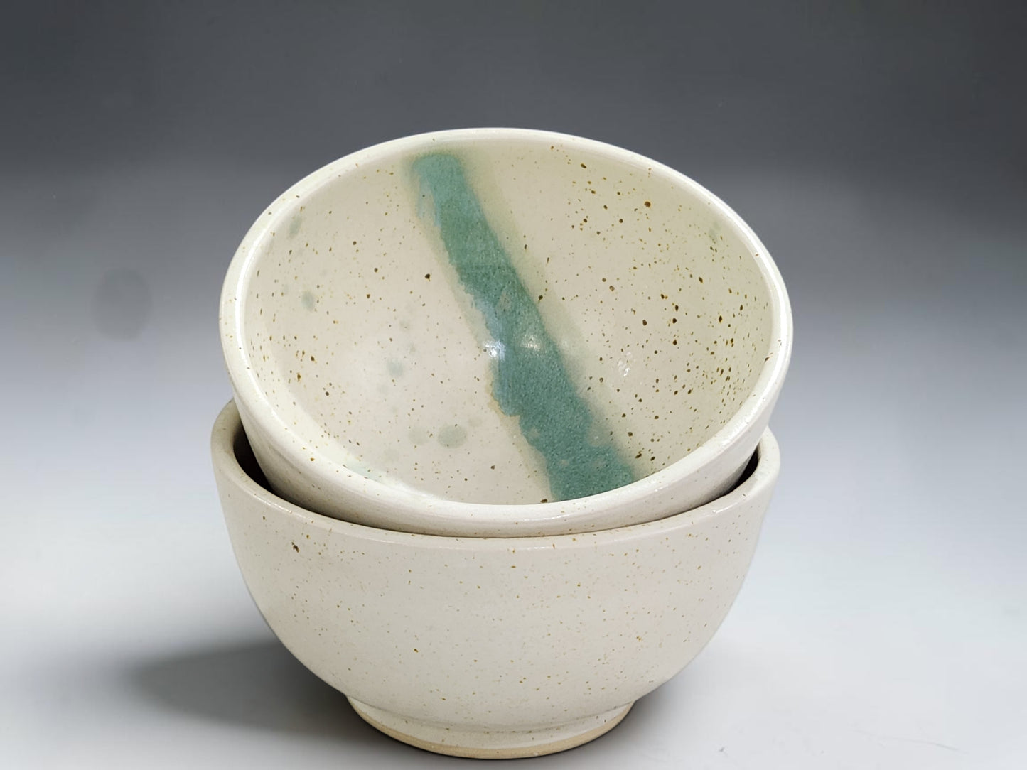 Handmade pottery cereal bowls speckled cream with green slash