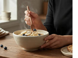 Handmade ceramic cereal bowl in speckled cream glaze