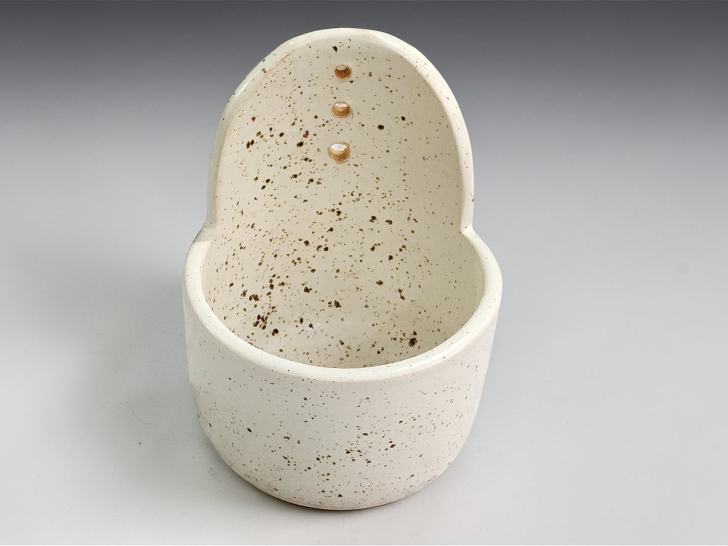 Handmade cream ceramic herb stripper with speckled glaze