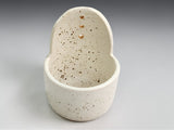 Handmade cream ceramic herb stripper with speckled glaze