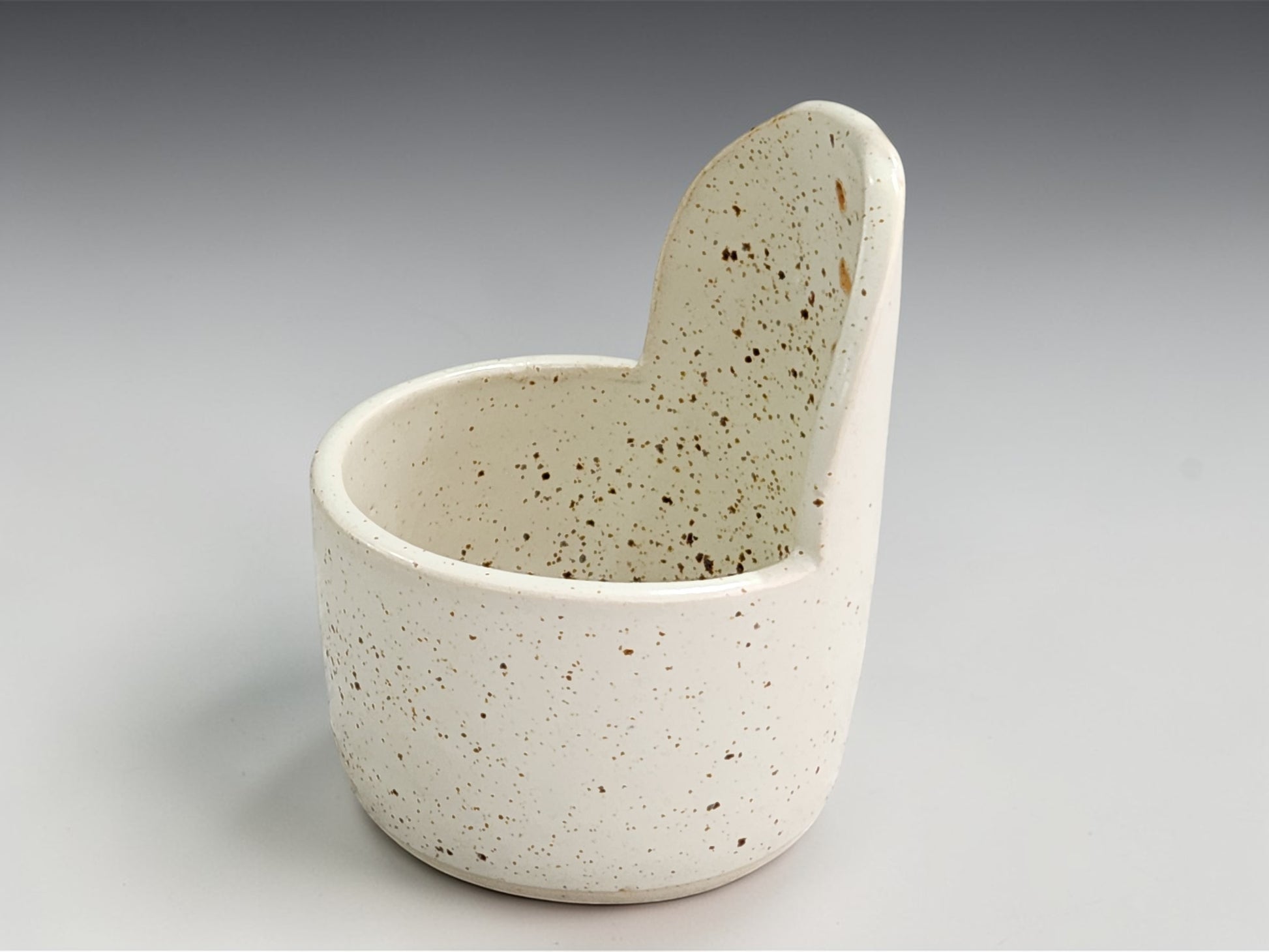 Artisan pottery herb stripper in speckled cream finish