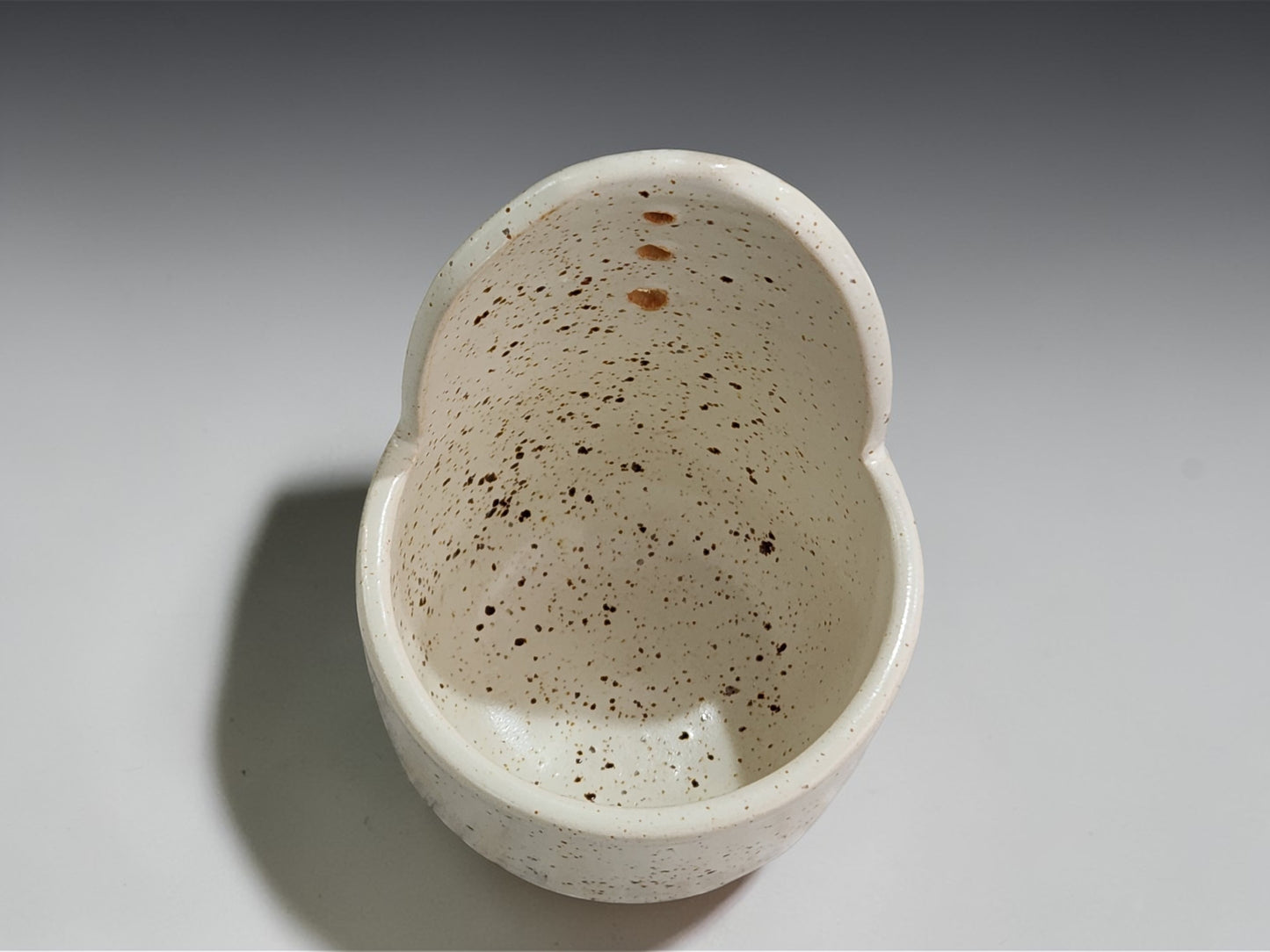 Unique speckled cream pottery herb stripper for fresh herbs