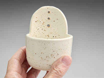 Handmade pottery herb stripper in cream with natural speckled detail
