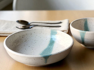 Handmade pottery pasta bowl speckled cream with green slash